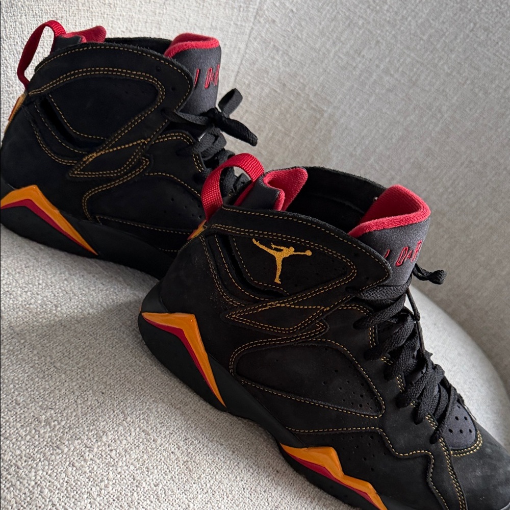 Jordan Black and Gold Sneakers with Red Accents
